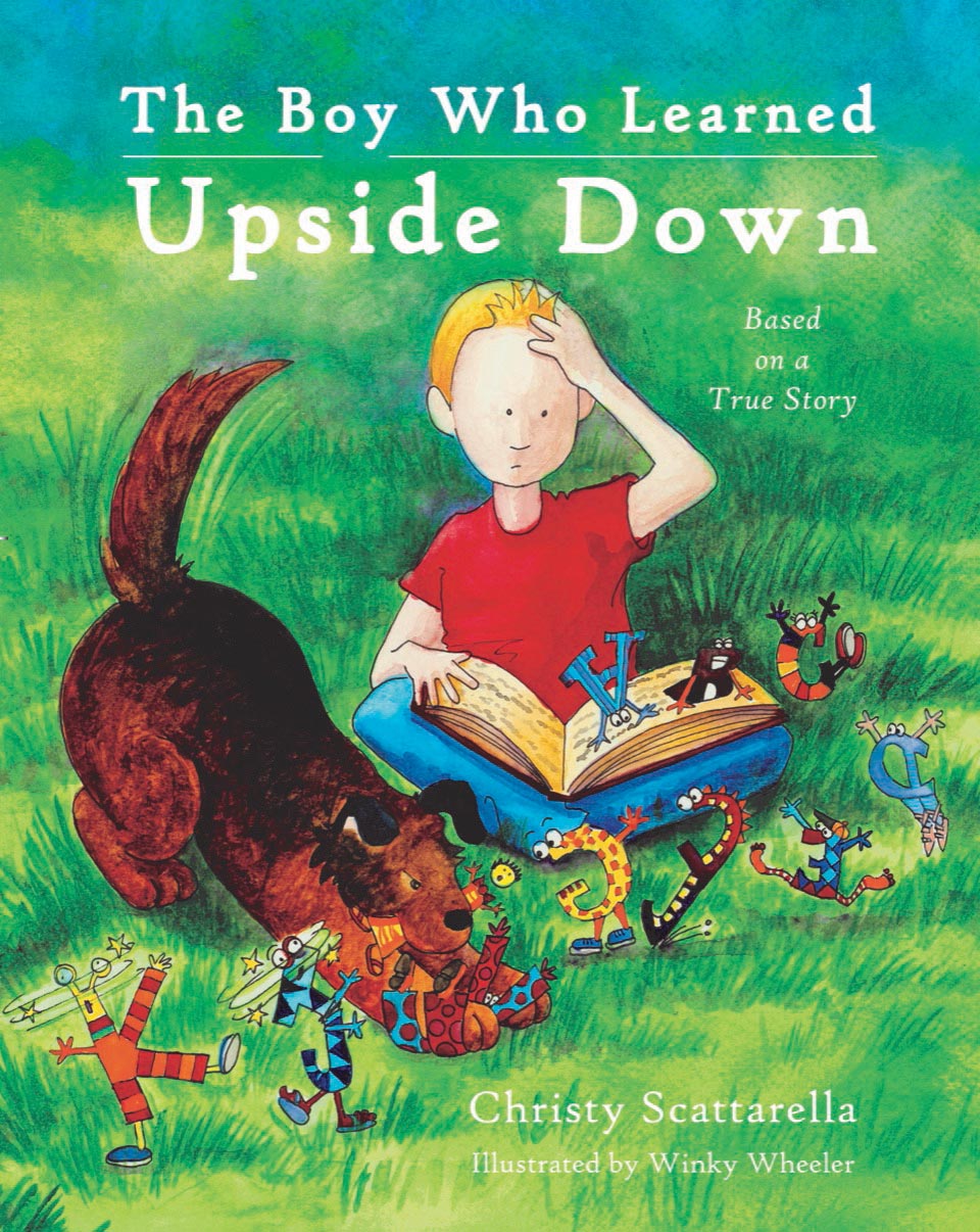 cover of The Boy Who Learned Upside Down boy in meadow with this dog