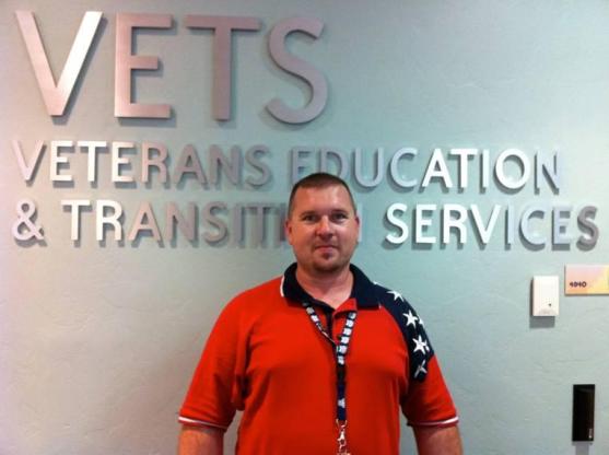 Photo in front o
f Veterans Education sign