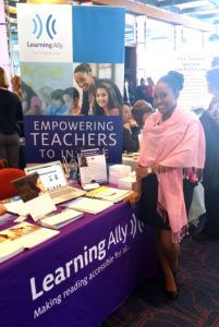 Ptahra visiting the Learning Ally booth at the Everyone Reading Conference 2014.