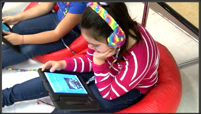 A student reading Learning Ally audiobooks at Arcola Elementary.