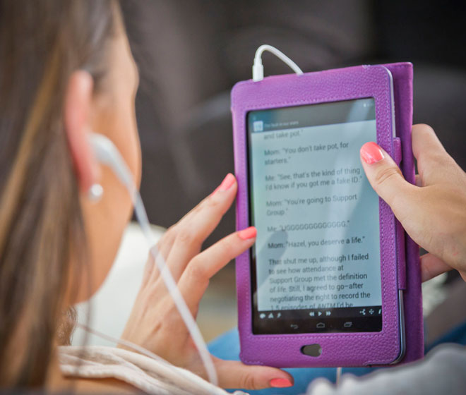 student reading an audiobook