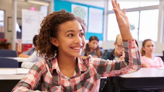 excited student raising hand in class