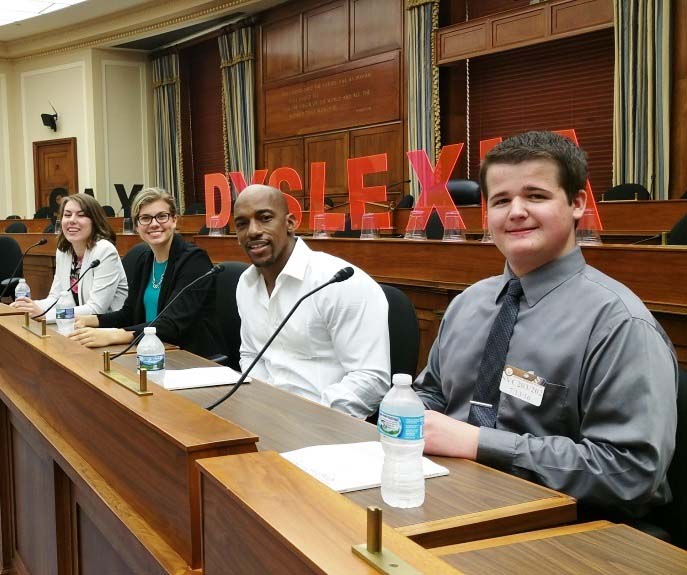 people seated in a court for a dyslexia conference