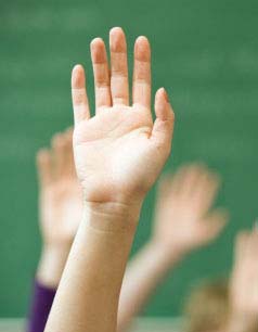 Hands Raised in a Classroom